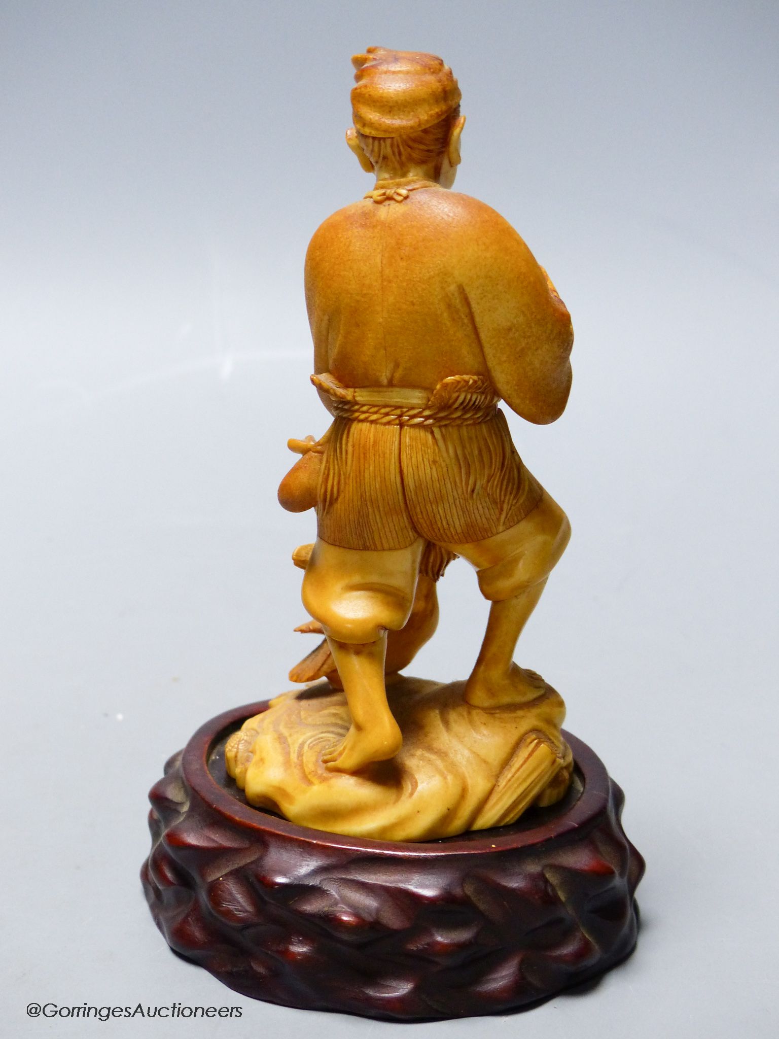 A Japanese ivory figure of a cormorant fisherman, early 20th century